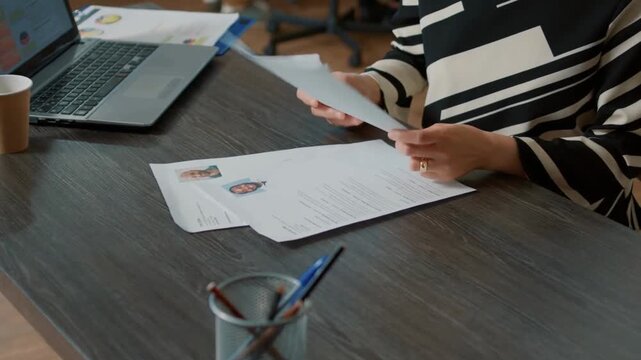 HR Specialist Reviewing Candidate Resume Before Interview
