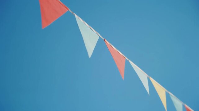 colorful triangular pennant banner on blue background