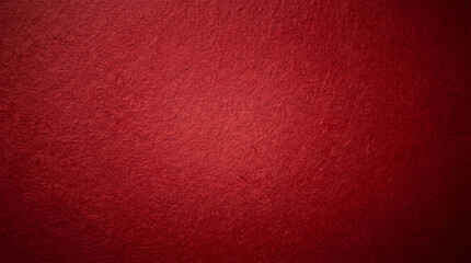 Fototapeta premium Dark and moody deep red textured paper background with rough surface and a subtle vignette.