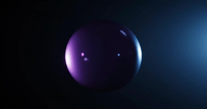 A vibrant purple bubble floating in a dark space, illuminated by soft blue light, creating a surreal atmosphere