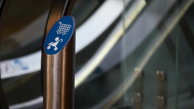Escalator sign for strollers and shopping carts in a mall