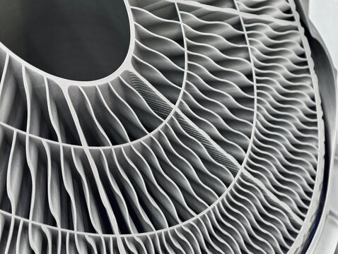 Additive manufacturing process showcasing metal products created through advanced 3D printing techniques in an industrial setting