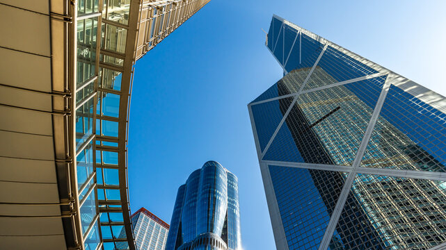 Low Angle View of Modern Glass Skyscrapers in Financial District Against Clear Blue Sky