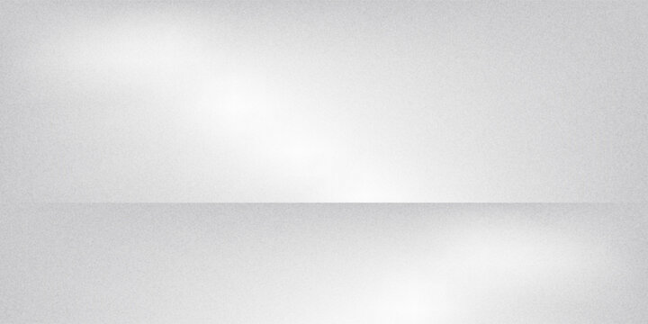 A minimalist white and grey wall interior background with soft window shadows. Ideal for studio backdrops, product presentations, and text insertions, creating a clean and modern aesthetic.