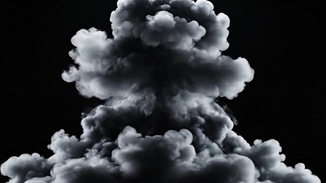 Massive gray smoke cloud expanding rapidly against a dark black background