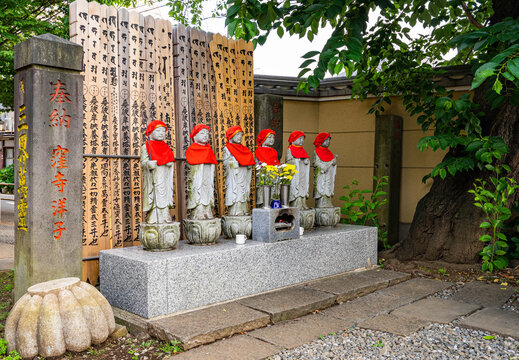 Six Jizo Bodhisattva Statues with Red Bibs at Japanese Buddhist Temple, Tokyo