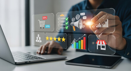 Person using transparent digital interface with data charts and icons.