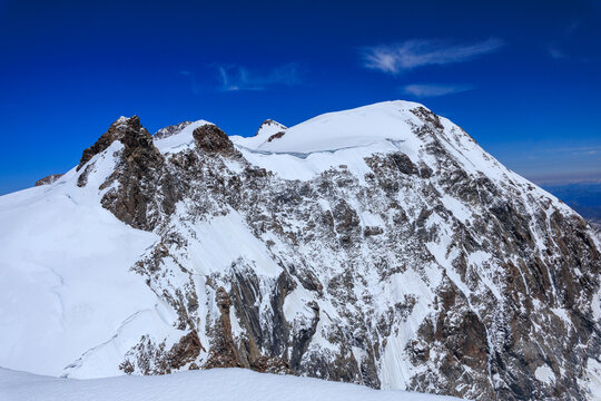 Mountain glacier panorama of Monte Rosa massif with summits Corno Nero (Schwarzhorn), Ludwigsh&ouml;he, Zumsteinspitze and Parrotspitze (left to right) seen from Vincent Pyramid in Pennine Alps, Italy