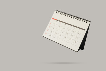 Fototapeta premium Minimalist Levitating Desk Calendar Mockup on Gray Background