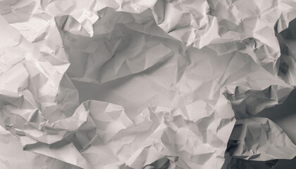 Obraz premium Detailed close-up view of a textured crumpled white paper surface, showcasing intricate creases and wrinkles for an abstract background