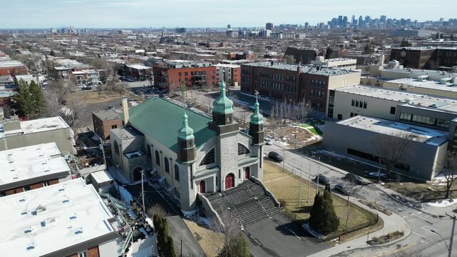 Aerial view of Assumption of the Blessed Virgin Mary Catholic Church in Montreal on a clear winter day. g