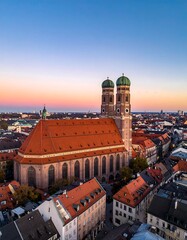 Obraz premium Aerial view of a European city at sunset with a large church