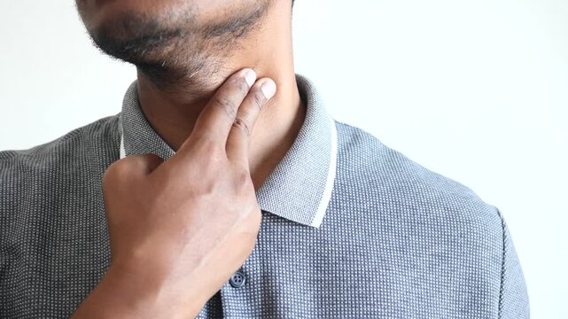 Man checks pulse on neck measuring heart rate to assess health