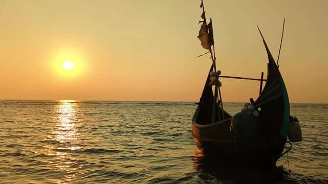 4K Cinematic Golden Hour Sunset Over Ocean with Silhouette of Traditional Fishing Boat cox's bazar