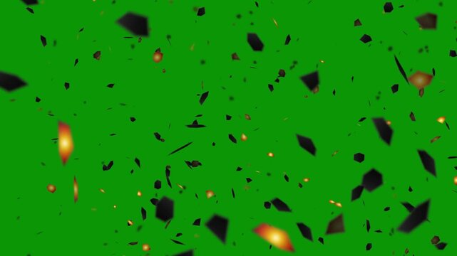 Fiery explosion debris and glowing fragments scattering in motion, isolated on a vibrant green screen for digital compositing effects