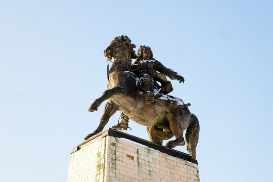 Equestrian monument to Vasily Tatishchev in Tolyatti, winter view with snow on bronze statue against clear blue sky, low angle shot