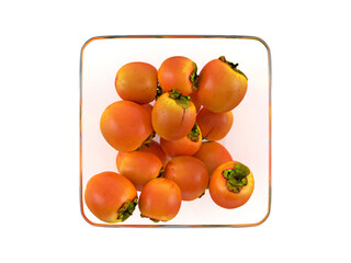 Glass bowl with persimmons