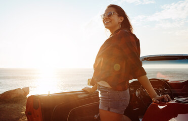 Car, beach and woman with vacation, smile and travel for weekend break, sunshine or getaway trip. Ocean, vehicle and person with happiness, transport or tropical island for summer holiday in Zanzibar