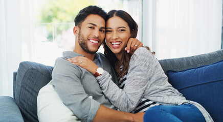 Obraz premium Care, hug and portrait of couple on sofa in home for bonding, love and happiness in relationship. Smile, relax and woman embracing man in living room for trust, safety and marriage in apartment.
