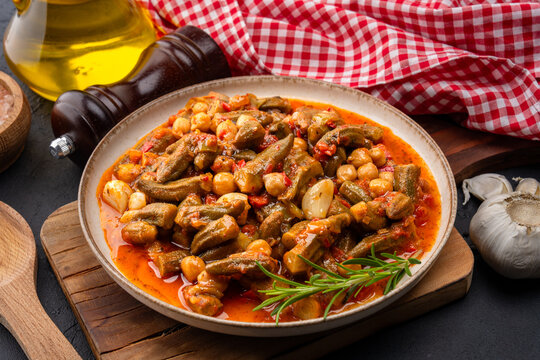 Freshly cooked okra dish on black stone table background