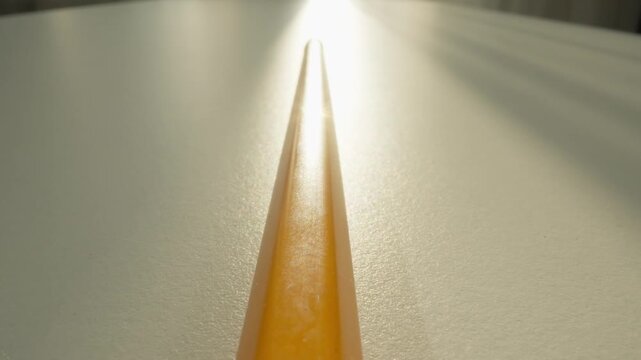 Pencil Tip Closeup. Close Examination Of Pencil Tip Highlighting Wood Grain And Graphite Core. Highly Detailed Macro Photograph Capturing Sharpened Pencil Tip With Shadow And Texture