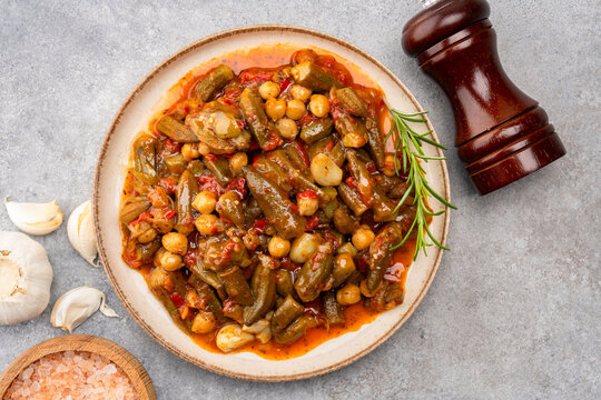 Freshly cooked okra dish on stone table background