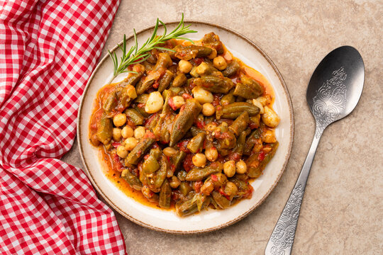 Freshly cooked okra dish on stone table background