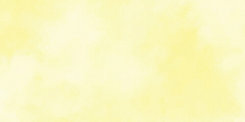 Obraz premium Soft pale yellow watercolor background with cloudy abstract texture.