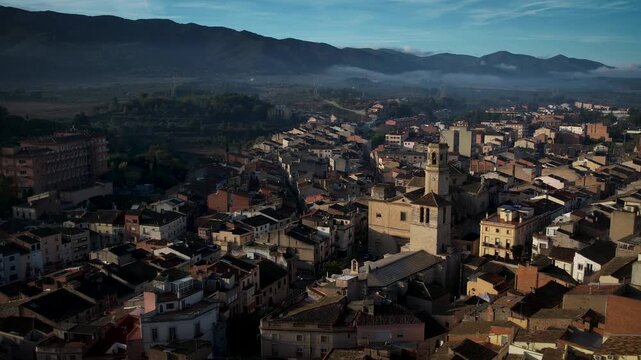Footage of Espluga de Francoli town in Catalonia with sunrise and mountains in the back. High quality 4k drone footage