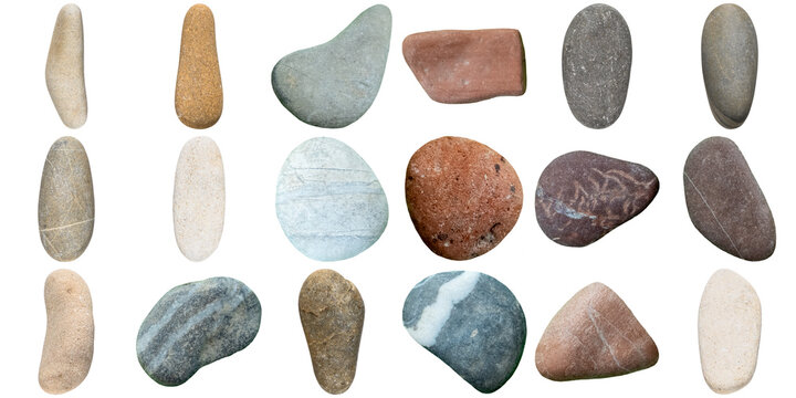 A beautiful collection of elongated, smooth, natural beach pebbles in earthy tones and various textures, isolated.