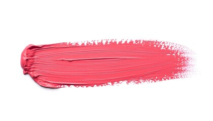 Cosmetic brush stroke swatch in coral pink color on white backdrop for beauty product use