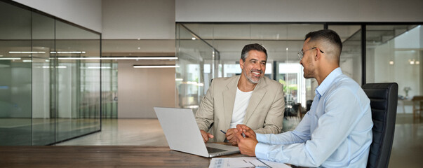 Happy professional business team people of two smiling latin executive business men having...