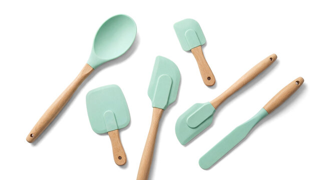 Modern mint green silicone kitchen utensils with wooden handles for cooking and baking.