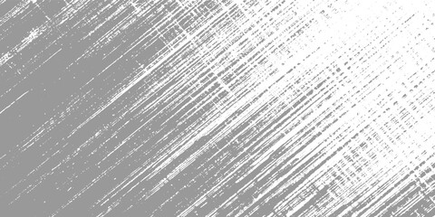 Fototapeta premium Gray and white textured background with diagonal scratch marks and speckles