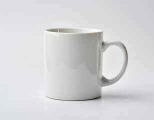 Obraz premium Simple white ceramic mug with handle on clean background perfect for coffee or tea