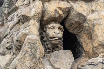 Obraz premium Part of the statue of St Vitus with the lions head on Charles Bridge in Prague old city in Czech Republic