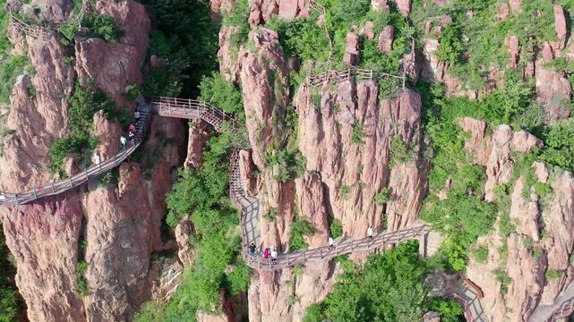 Aerial View of Red Rock Cliffs with Mountain Paths and Visitors