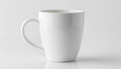 Obraz premium White ceramic mug on white surface provides sleek design element with copy space