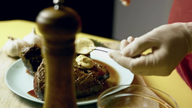 Rubbing the roasted beef tenderloin with Dijon mustard for further cooking