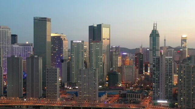 Dalian China Skyline at Dusk with Illuminated Towers and City Lights