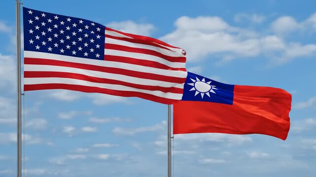 United States and Taiwan flags flying together against blue sky