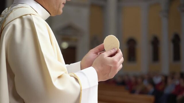 Priest with a consecrated host.