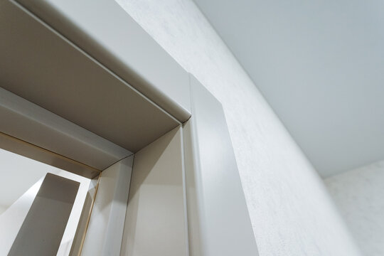 Preparation Phase Showing Flawless Door Frame Installation Technique. Sophisticated Stage Demonstrating Seamless Connection Between Trim Molding And Plaster Surface In Renovation Project