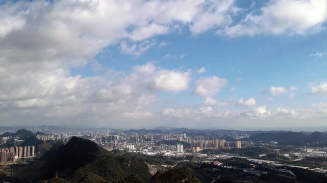 Guiyang China Cityscape with Mountains and Clouds Aerial View