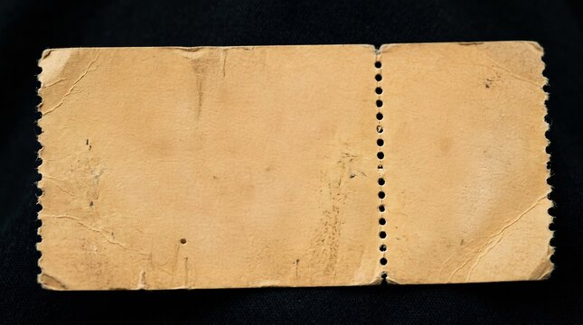 Old ticket shows aged paper gracefully on a dark background.