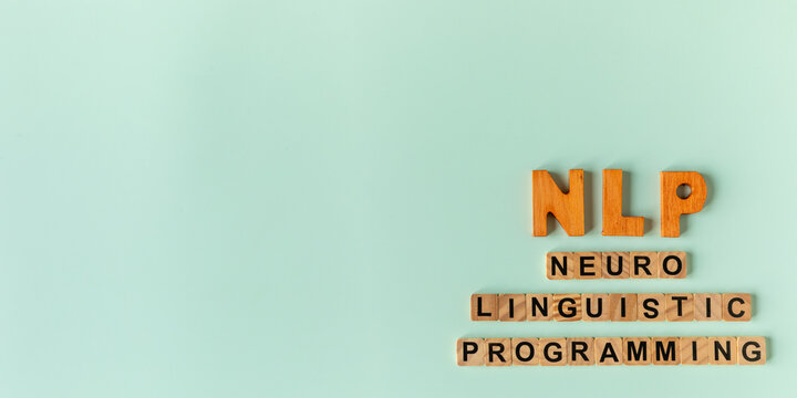 NLP - Neuro Linguistic Programming concept. A psychotherapy approach that links neurological processes, language, and behavioral patterns. Green pastel background with copy space. 