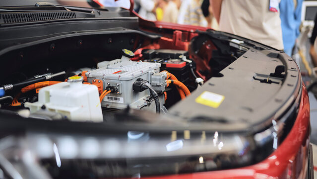 Electric vehicle engine with power inverter system at a car technology exhibition