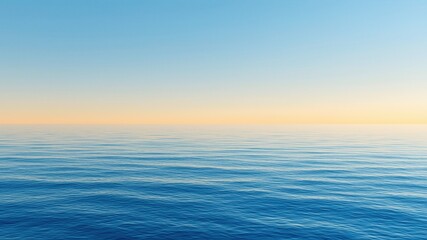 Fototapeta premium Smooth blue ocean surface under a calm clear sky at sunset