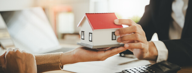 Fototapeta premium Hand of landlord, realtor pointing sign signature contract rental, purchase, buyer home or apartment with tenant, client after banker agreement mortgage, loan success or done. Property agent concept.