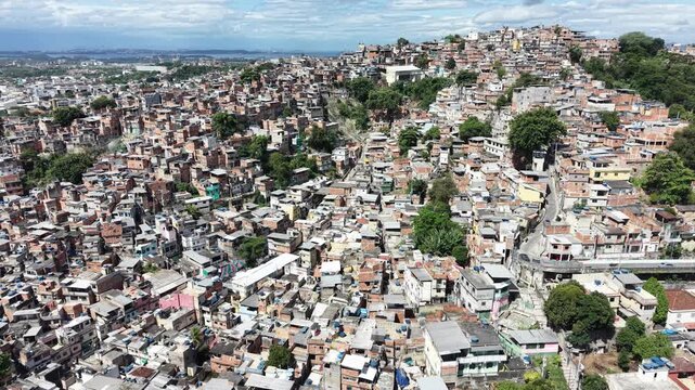 Aerial drone view of Favela Of Cantagalo, Rocinha favelas spread out on the mountain in Sao Conrado , Rio de Janeiro, Brazil.